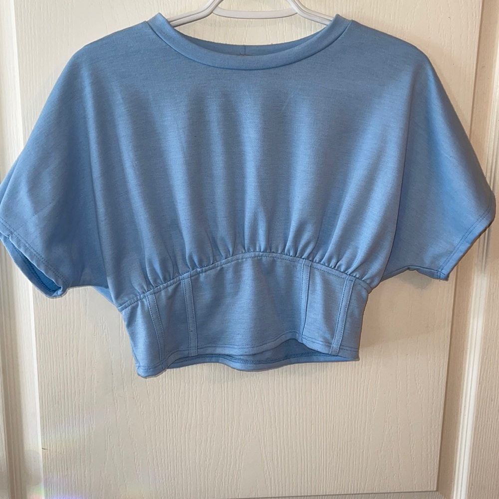 Baby blue house with corset fit around the waist